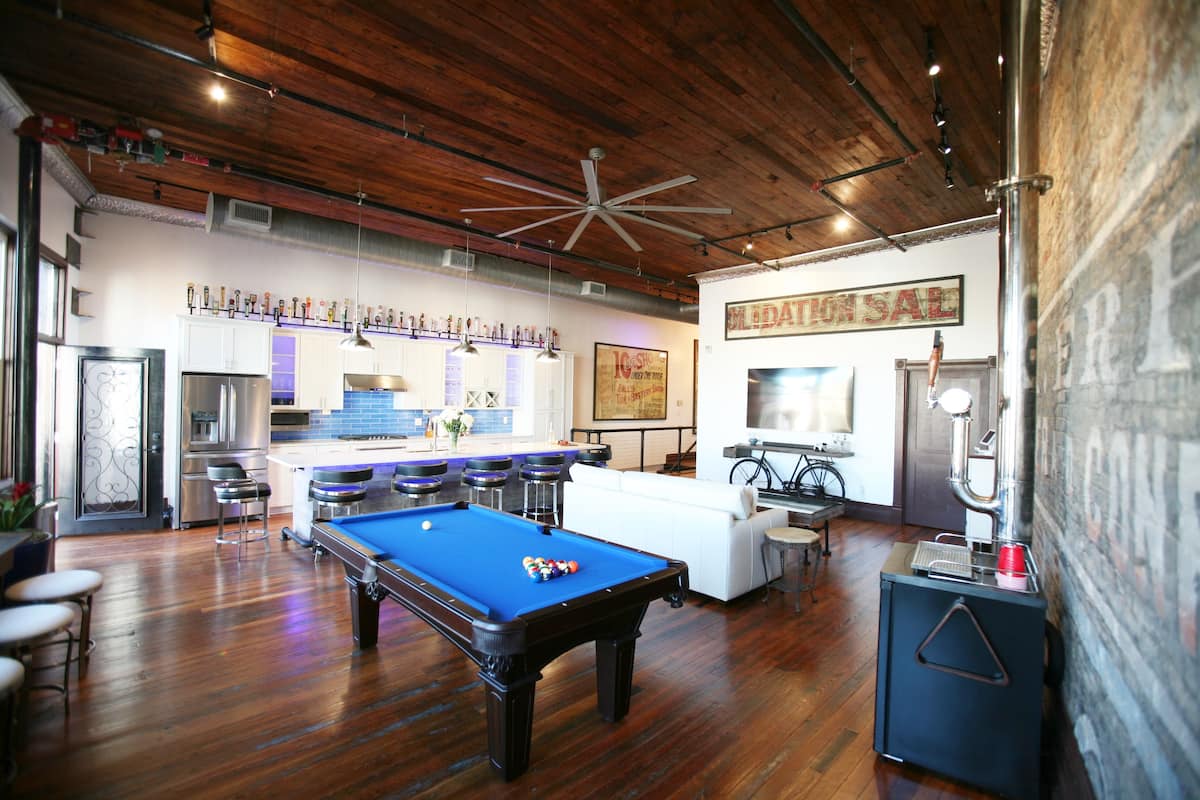 Pool table beneath the loft's original wood ceiling